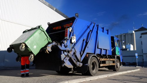 Workers managing demolition waste at a construction site in Woolwich