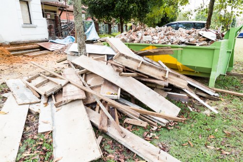 Professional waste removal team sorting debris in Woolwich